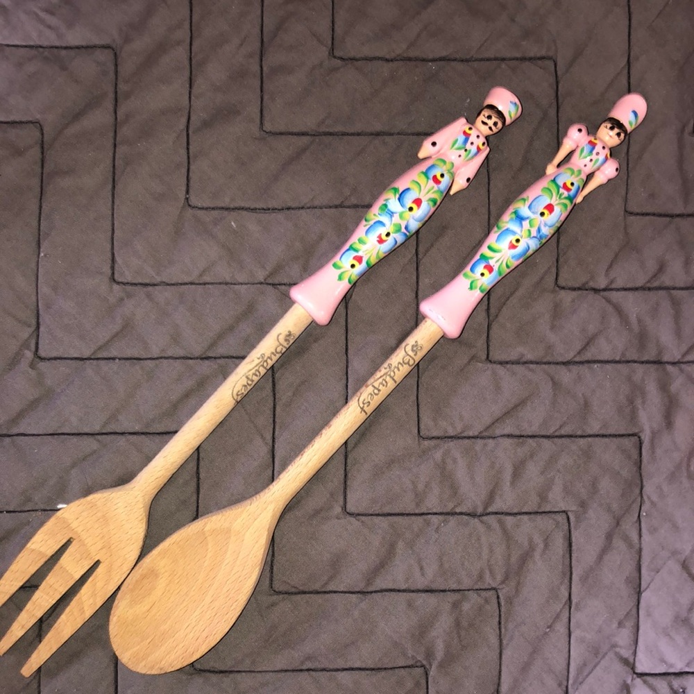 Wooden serving, spoons, maiden Budapest. Pink wooden lady on the top.